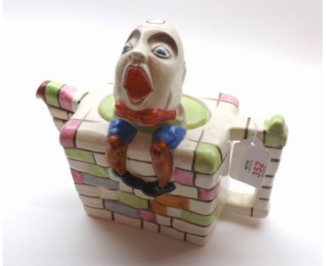A Novelty Humpty Dumpty Teapot marked to base "England RD830104", decorated with coloured bricks, 8 1/2" long 