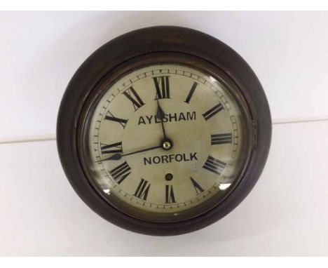 An early 20th Century Quartered and Stained Walnut Dial Timepiece, the plain surround to a spun brass bezel enclosing an 8" p