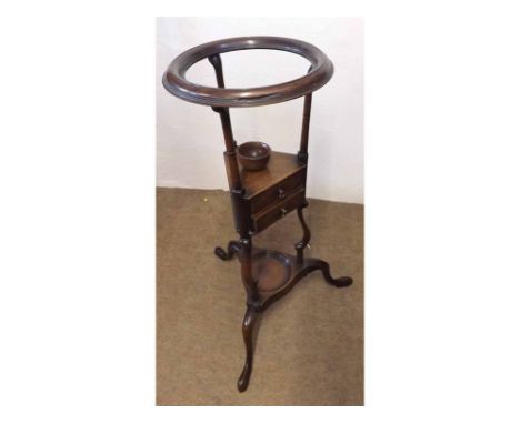 A 19th Century Mahogany washstand, circular bowl support over two small drawers and tripod base with cabriole legs, 32" wide 