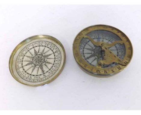 An early 19th Century Brass Cased Compass/Sundial, the circular case with screw-off cover inset with a paper dial depicting t