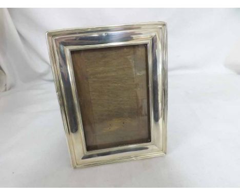 A George V Silver Photograph Frame of rectangular form, fitted with easel back, hallmarked Birmingham 1912, 7 1/2" high   40-