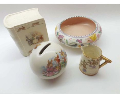 A Mixed Lot comprising: two Royal Doulton Bunnykins Moneyboxes, a Round Poole Dish and a small Worcester Jug of tapering form