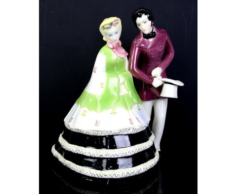 Lenci, a porcelain figure group of a gentleman doffing his hat to a lady, painted marks and incised no. 619, 30.5cm highNote: