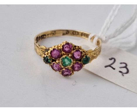 A Victorian emeralds and ruby daisy ring, 9ct, size M