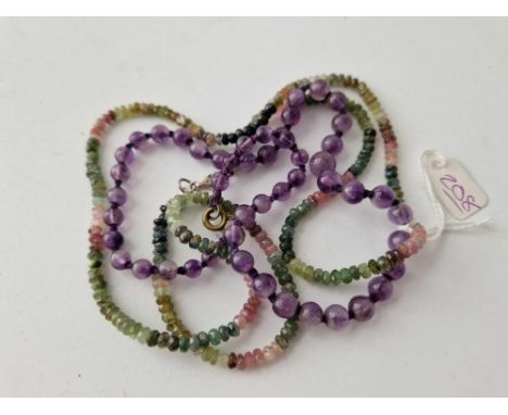 A amethyst bead necklace and muti gem set necklace