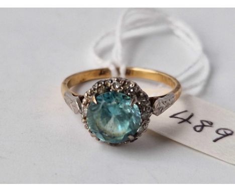 A BLUE ZIRCON AND DIAMOND CLUSTER RING, 18 ct, size O, 3.8 g