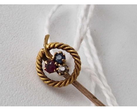 Edwardian 15ct stamped stick pin set with sapphire, ruby anddiamond in a clover design