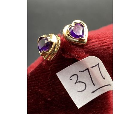 A pair of heart shaped modern amethyst earrings