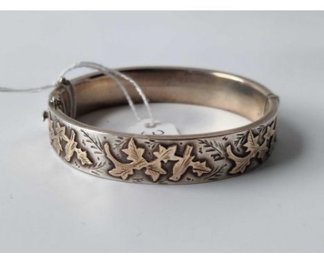 An antique silver and gold hinged bangle with full Chester hallmarks 21.4g