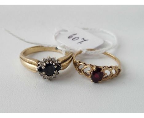 A sapphire and diamond ring and a garnet ring size N and O 5 gms inc.