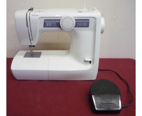 Toyota RS2000 Electric Sewing Machine with instruction manual, foot control etc and a Jones Electric Sewing Machine in case (