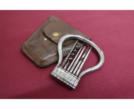 Victorian pocket compendium, with six steel tools including corkscrew, descaler, screwdriver etc, in folding leather case (8c
