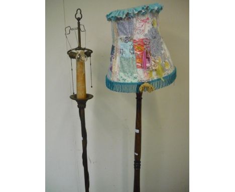 Decorative metal twin headed standard lamp and another carved and turned wood standard lamp (2) 