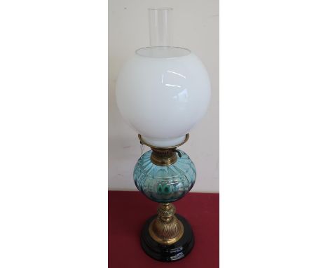 Early 20th C paraffin lamp, turquoise resevoir and opaque shade, on embossed brass pedestal base (H60.5cm) 
