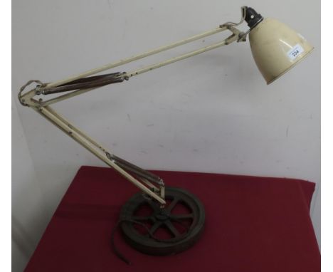 Machinist's angle poised lamp with industrial wheel base 