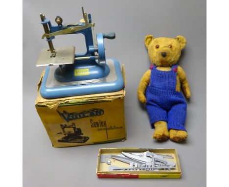 Plush teddy bear with jointed limbs, dressed in knitted blue dungarees, H40cm, an Eagle 1/1200 scale plastic model kit of H.M