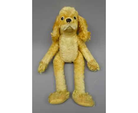 Steiff plush covered five joint long legged Spaniel, with applied plastic eyes and stitched nose H38cm