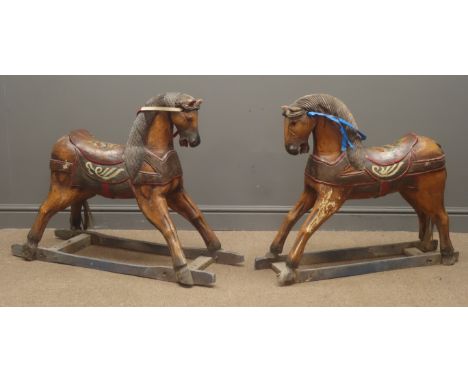 Two Vintage painted carved wooden small merry go round horses, open eyes and mouths with floral painted detail, L99cm, H70cm 