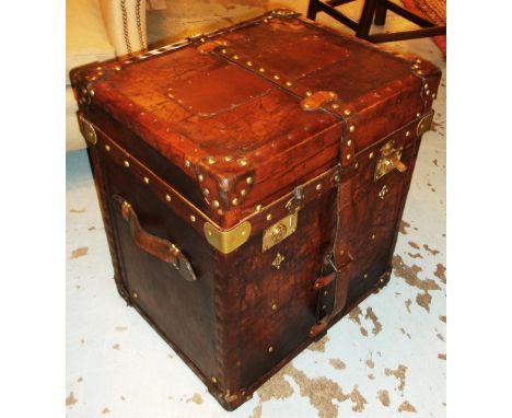 STEAMER TRUNK, brown leather bound and brass studded with hinged top and side handles, 57cm H x 51cm W x 41cm D. 
