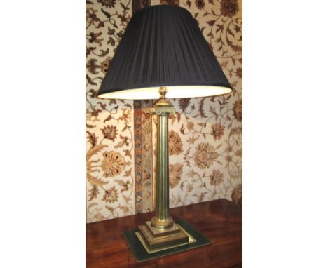 TABLE LAMP, Ionic column style gilt metal, with black pleated shade, 82cm H overall. 