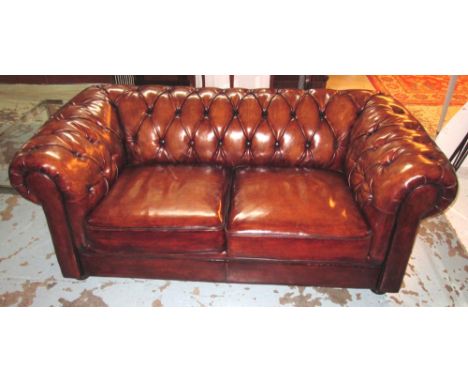 CHESTERFIELD SOFA, faded tan brown leather, deep button upholstered with two cushions, 180cm W. 