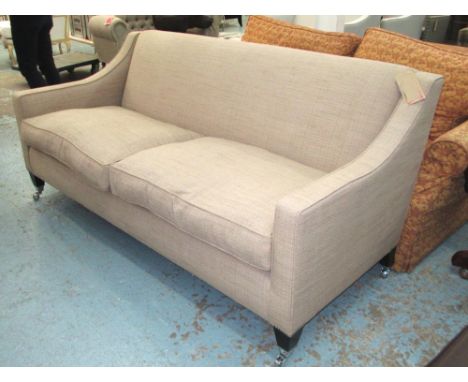 SOFA, Contemporary design, two seater, with sloping arms in oatmeal upholstery on square tapering legs with chrome castors, 1