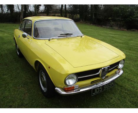 A 1972 Alfa Romeo 1300 GT Junior (105 Series), registration number JDS 969K, yellow. First registered in March 1972, this exa