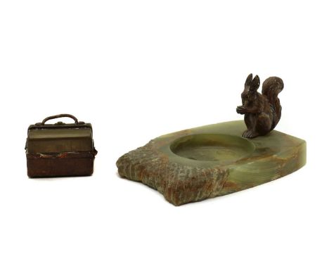 An onyx ashtray,mounted with a cold painted bronze squirrel,12cm long anda travelling inkwell,in the form of a Gladstone bag,