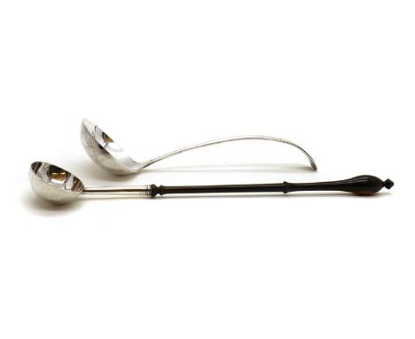 A George III silver toddy ladle,London 1731, with a turned wood handle,39cm longtogether with a silver ladle,by Allen &amp; D