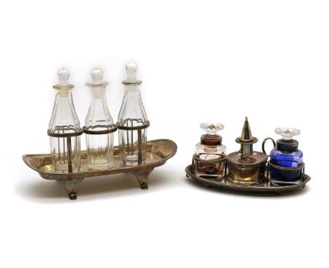 A Sheffield silver plated desk stand,early 19th century, with two glass bottles and stoppers and a detachable chamber stick a