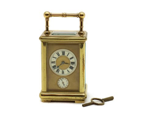 A brass carriage clock,late 19th century, retailed by Schleskicky, Frankfurt, with a pair of nested bells, with a repeater, t