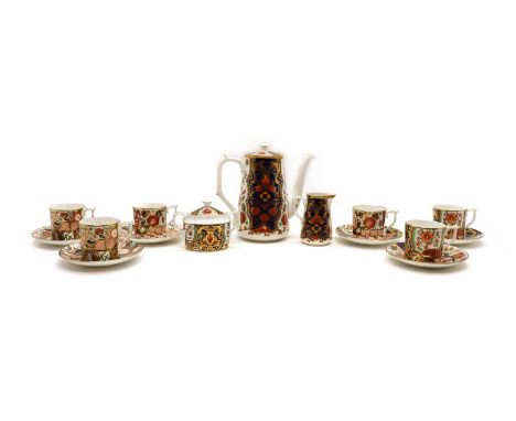 A Royal Crown Derby porcelain tea service,'The Curators Collection', serving six places, comprising a teapot, 19cm high, cups