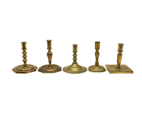 Five brass candlesticks, late 17th/early 18th century, each of squat form, with various shaped bases, 13cm to 15cm high (5)Co