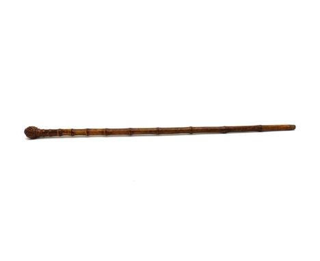 A Continental sword stick, late 19th century, with a bamboo root handle and shaft, mounted with a triangular section fullered