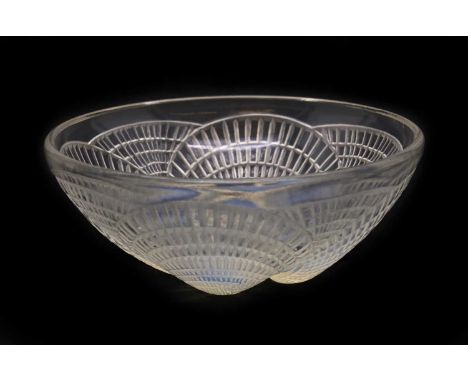 A Lalique 'Coquilles' opalescent glass bowl, moulded with shells, cut 'R.Lalique' and etched 'No. 3204' to the underneath, 13