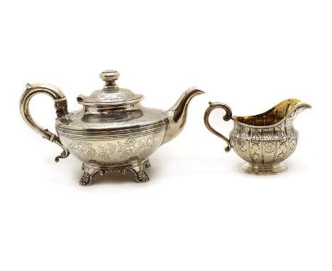 A Victorian silver teapot,by A B Savory & Sons, London 1838, with all-over engraved foliate decoration, on four scroll feet, 