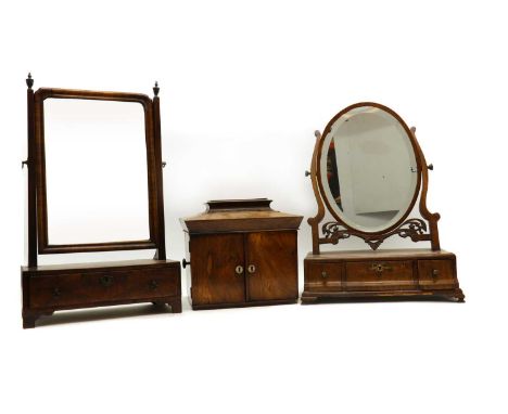A Victorian rosewood casket,the hinged top over two doors enclosing two drawers and a pull-out writing slope,30cm wide28cm hi