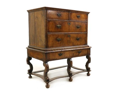 A walnut chest on stand,17th century and later, the two short and two long drawers on a base with a single drawer, square, sc