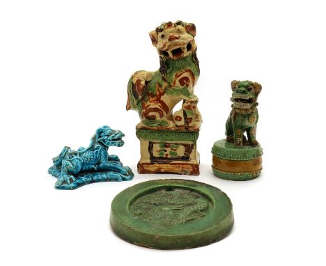 A group of Chinese stoneware,20th century, comprising:two Buddhist lion incense holders,both seated on a pedestal, with bulgi