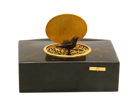 A Swiss musical snuff box,late 19th century, with a singing bird rising from below an engraved brass cover,9.7cm wideProvenan
