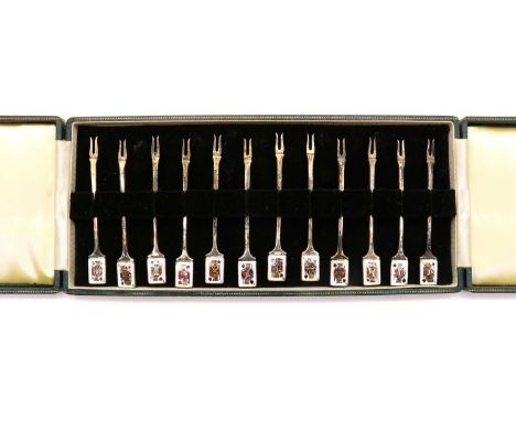 A cased set of twelve silver and enamelled cocktail sticks,by Garrard &amp; Co., Birmingham 1961, each with two prongs, the h