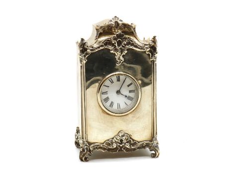 A silver cased clock,by William Comyns &amp; Sons, London 1902, with a single train movement, the scrolled foliate decoration