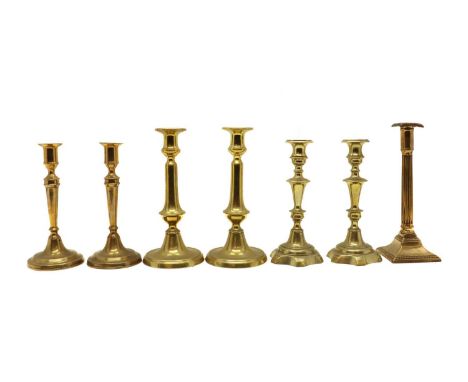 Three pairs of brass candlesticks,early 19th century, 26cm highest and a single reeded column candlestick, 26.5cm high (7)Con