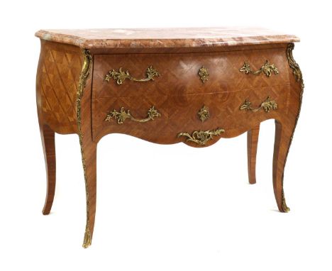 A Louis XV-style tulipwood and kingwood commode,early 20th century, French, of serpentine outline, the rouge marble top above