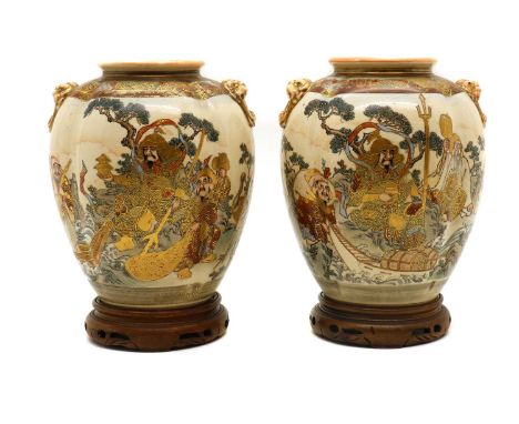 A pair of Japanese Satsuma ware vases,early 20th century, of lobed ovoid form, painted with The Seven Gods of Good Fortune, S