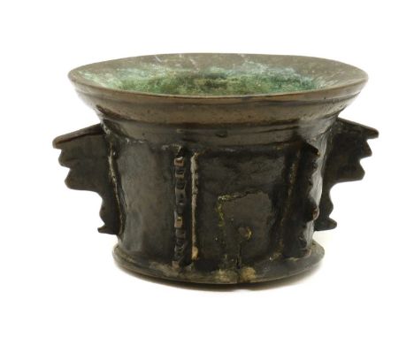 A bronze mortar,17th century, with ornate lugs to the sides,14.5cm diameter9.5cm highProvenance: The Estate of Mrs Althea Llo
