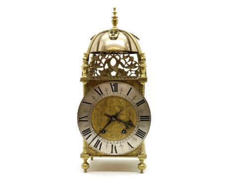 A reproduction brass lantern clock,the twin train movement striking on the bell,40cm highCondition ReportAppears good.No key.