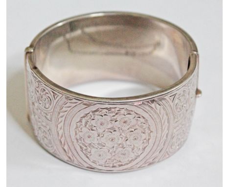A hallmarked silver bangle, diam. 6cm.