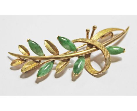 A yellow metal brooch set with jade marked '14k' and 'C.Y.L.', length 6cm, gross wt. 7.8g.