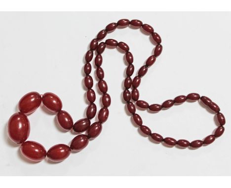 A string of vintage cherry amber bakelite beads, length 76cm, gross wt. 61g.